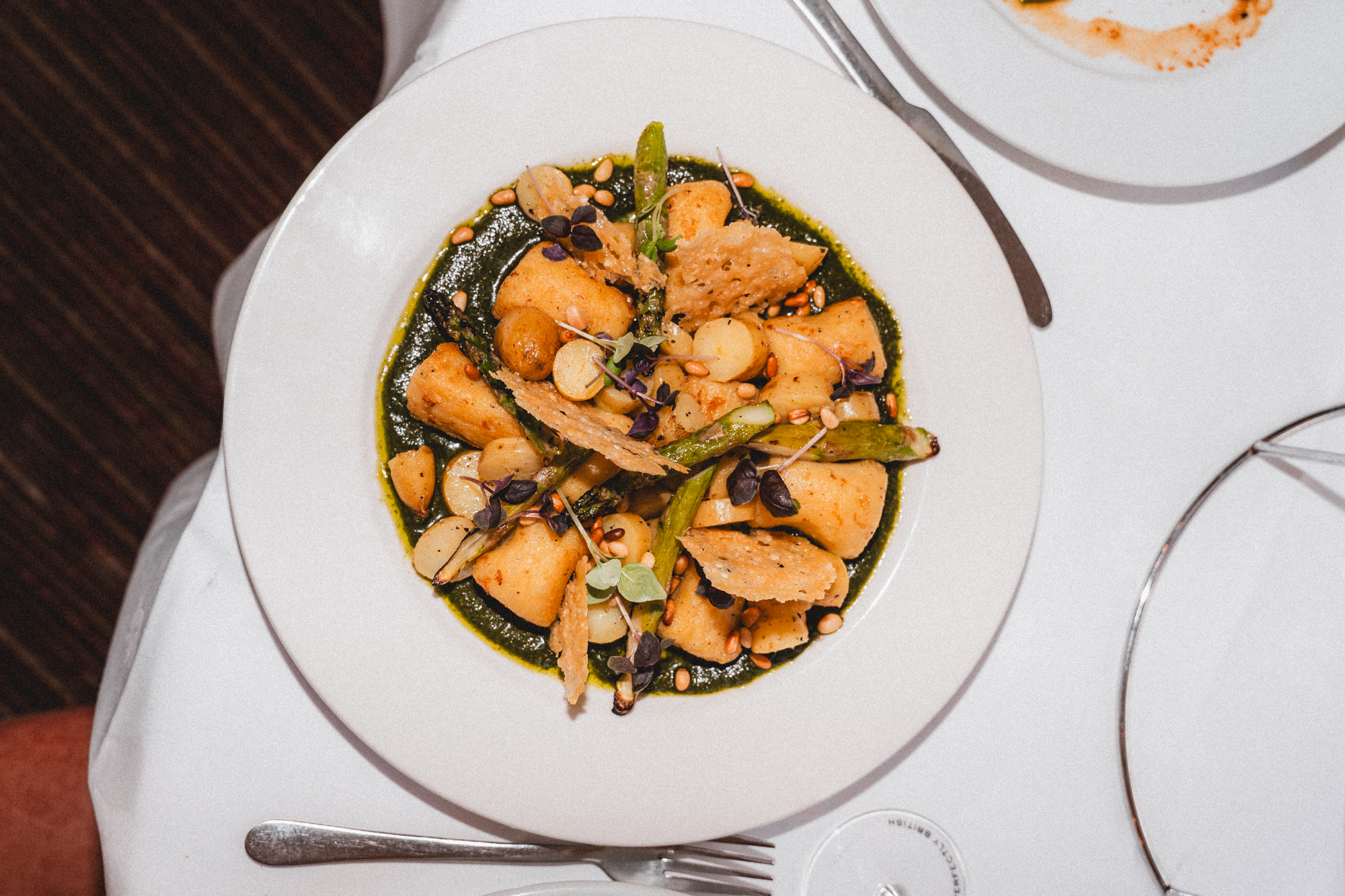 Gnocchi, basil pesto, charred asparagus, pine nuts, parmesan crisps